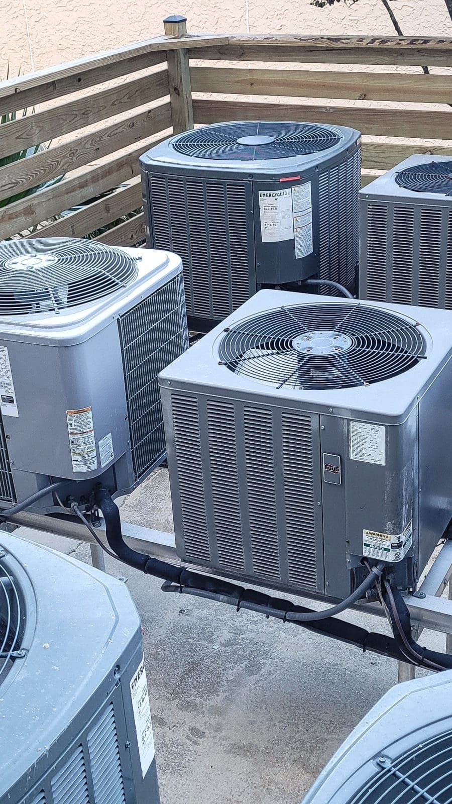 Air conditioners raised platforms at beach serviced by HVAC technicians . Air conditioners raised platforms at beach serviced by HVAC technicians .